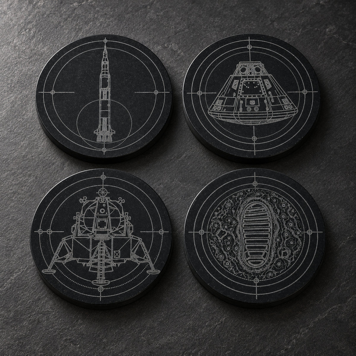 Apollo black marble coaster set with Saturn V, command module, lunar module, and lunar bootprint engravings