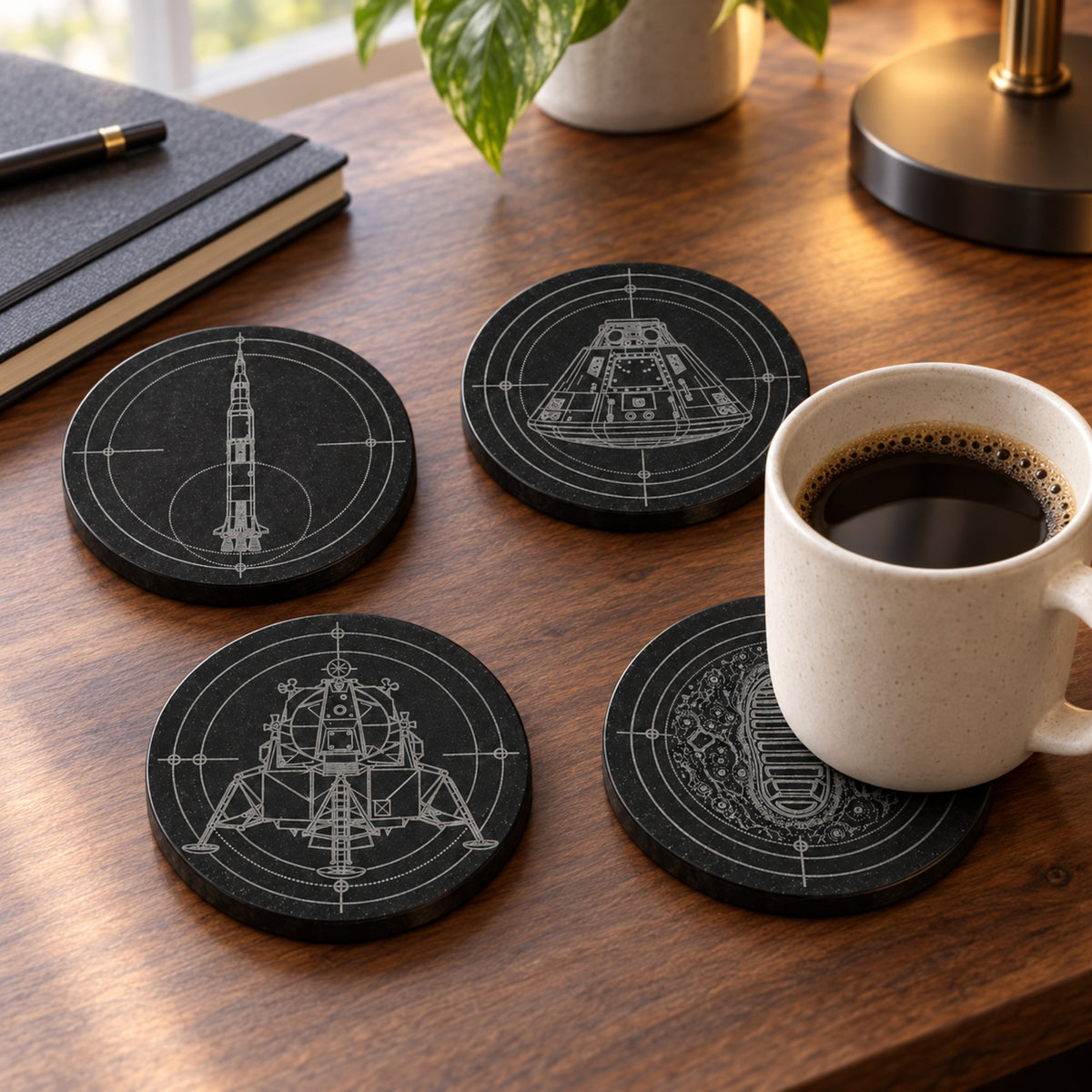 Apollo black marble coaster set displayed in a refined technical workspace