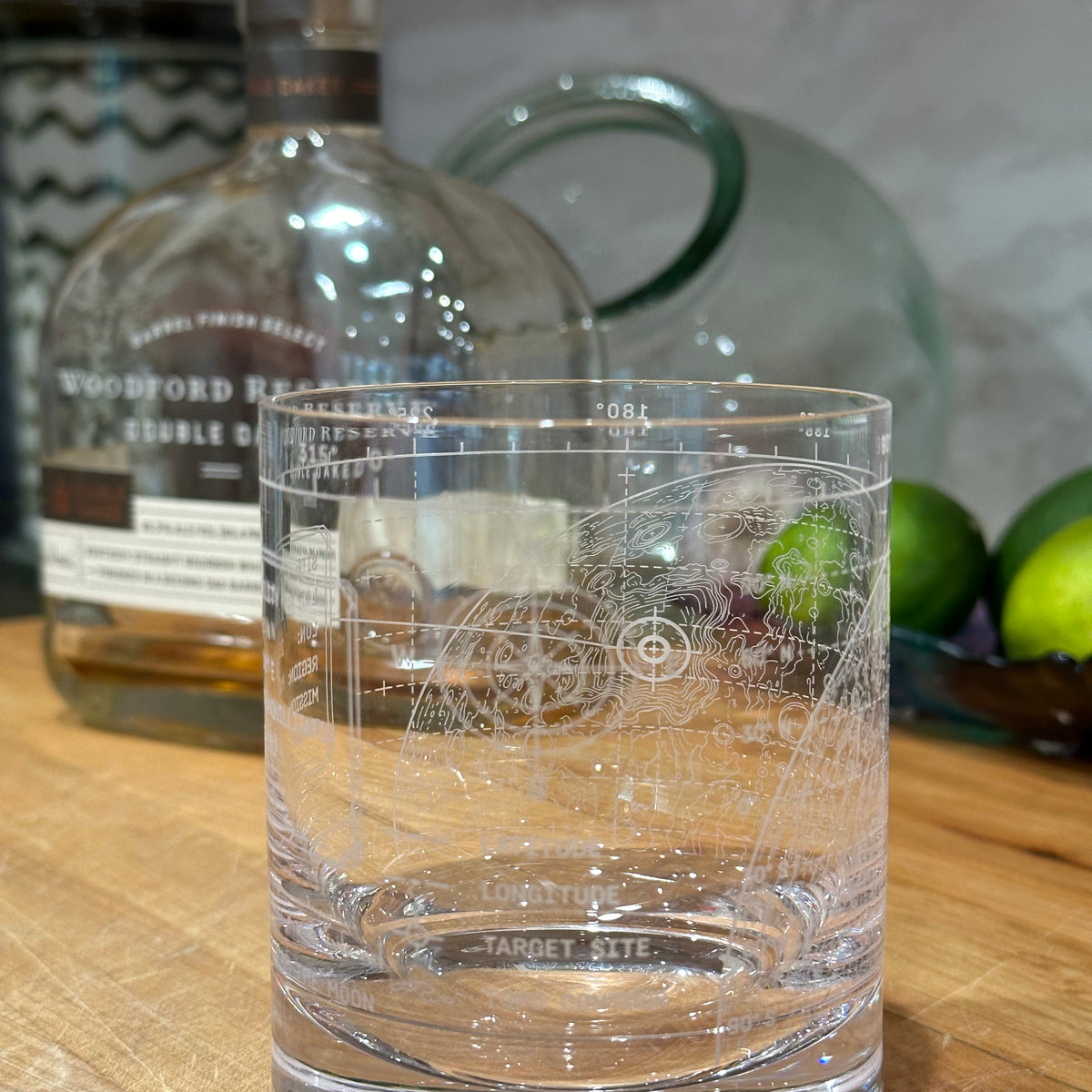 Vector Lunar Coordinates engraved crystal rocks glass in a refined home bar setting